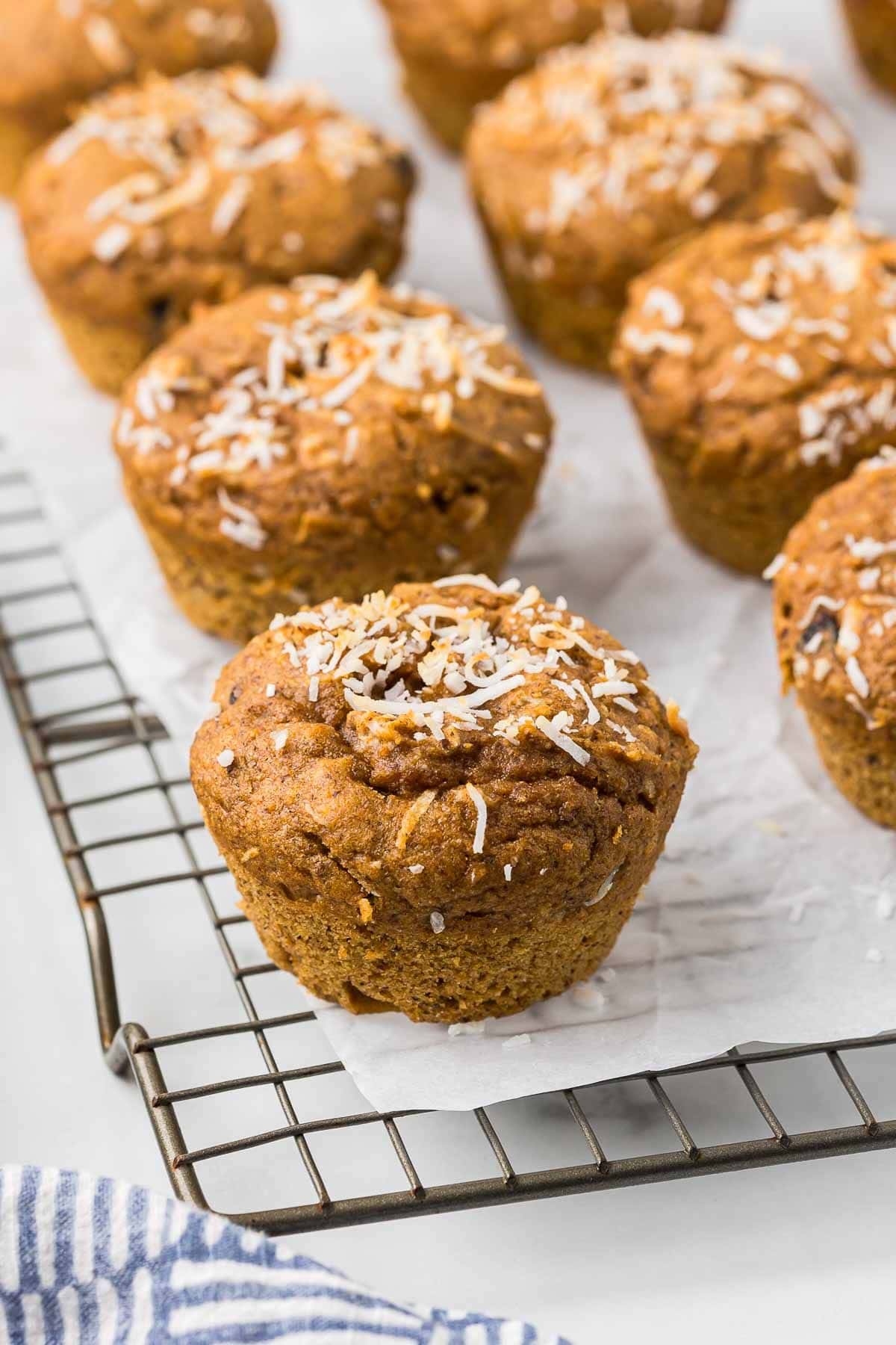 muffins on a wire cooling rack with parchment paper