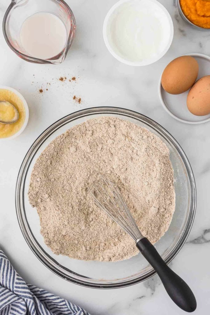 white whole wheat flour with brown sugar, pumpkin pie spice, and more dry baking ingredients