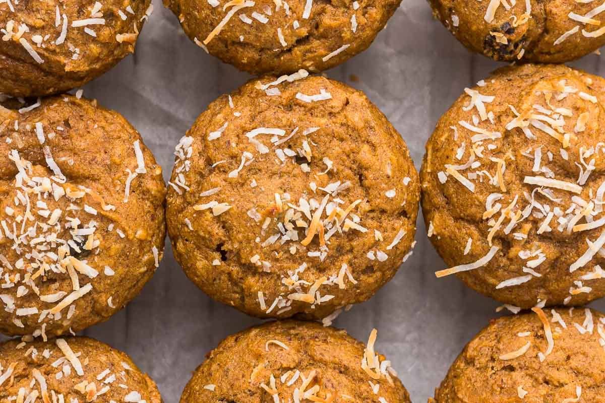 close up of whole wheat sweet potato muffins with shredded coconut on top