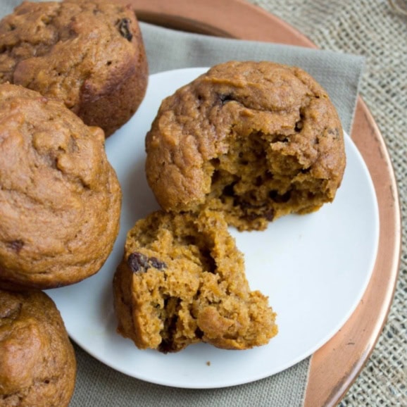 pumpkin applesauce muffins on a white plate