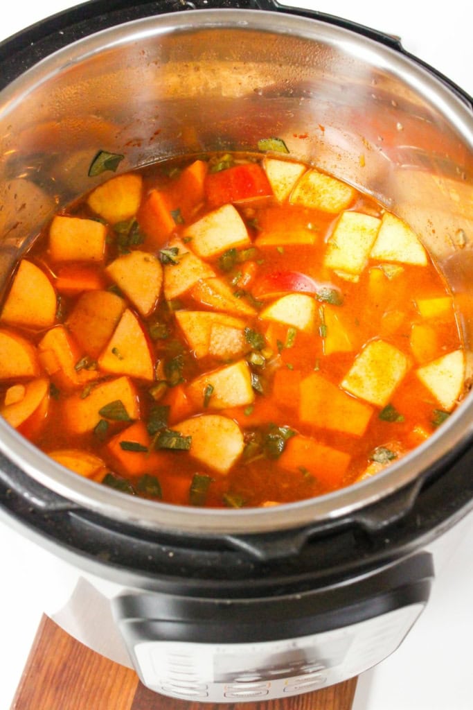 cubed butternut squash with broth in an Instant Pot