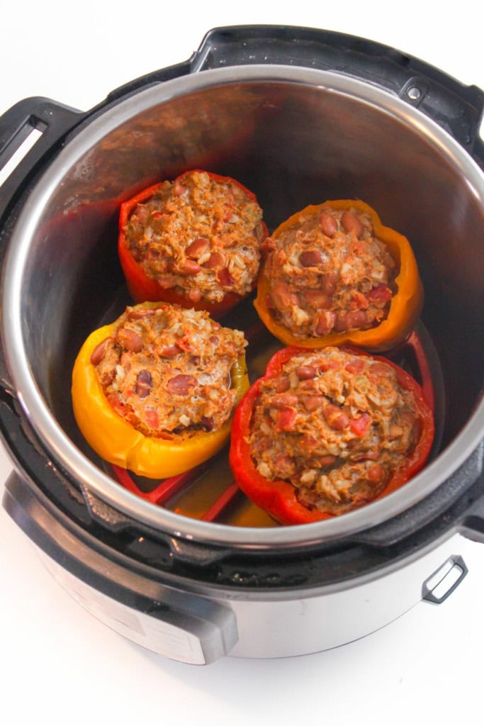 ground turkey filling in bell peppers inside a pressure cooker