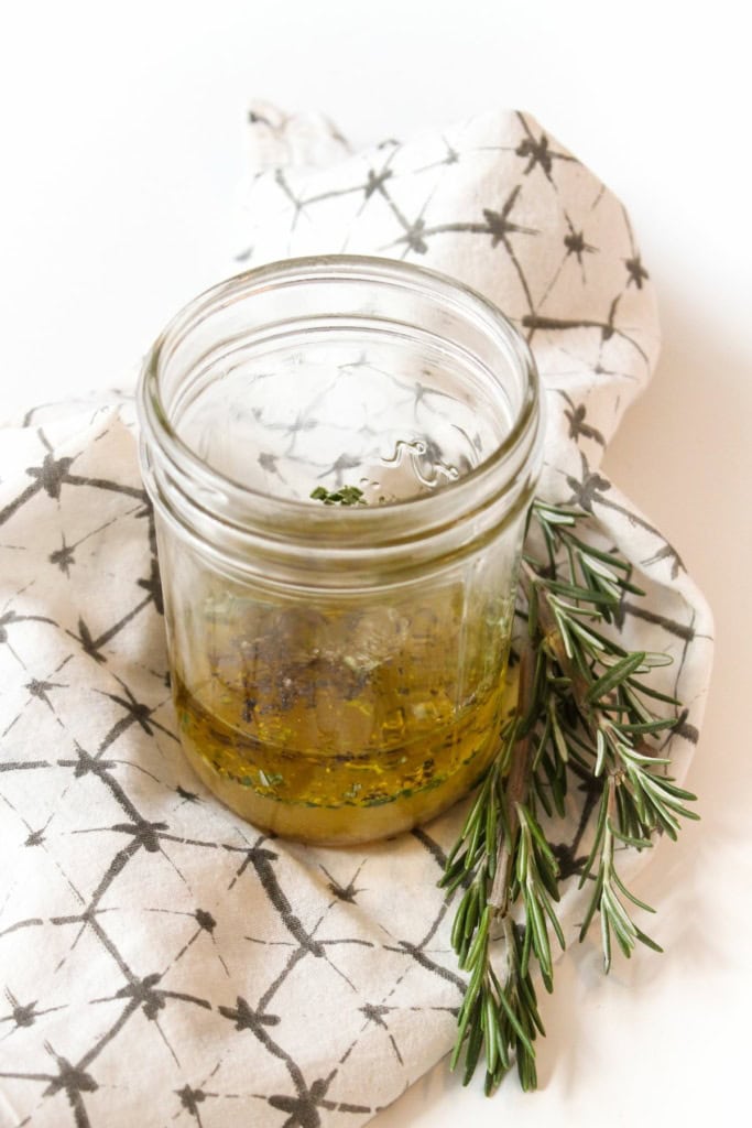 olive oil, maple syrup, dijon mustard, and apple cider vinegar in a jar