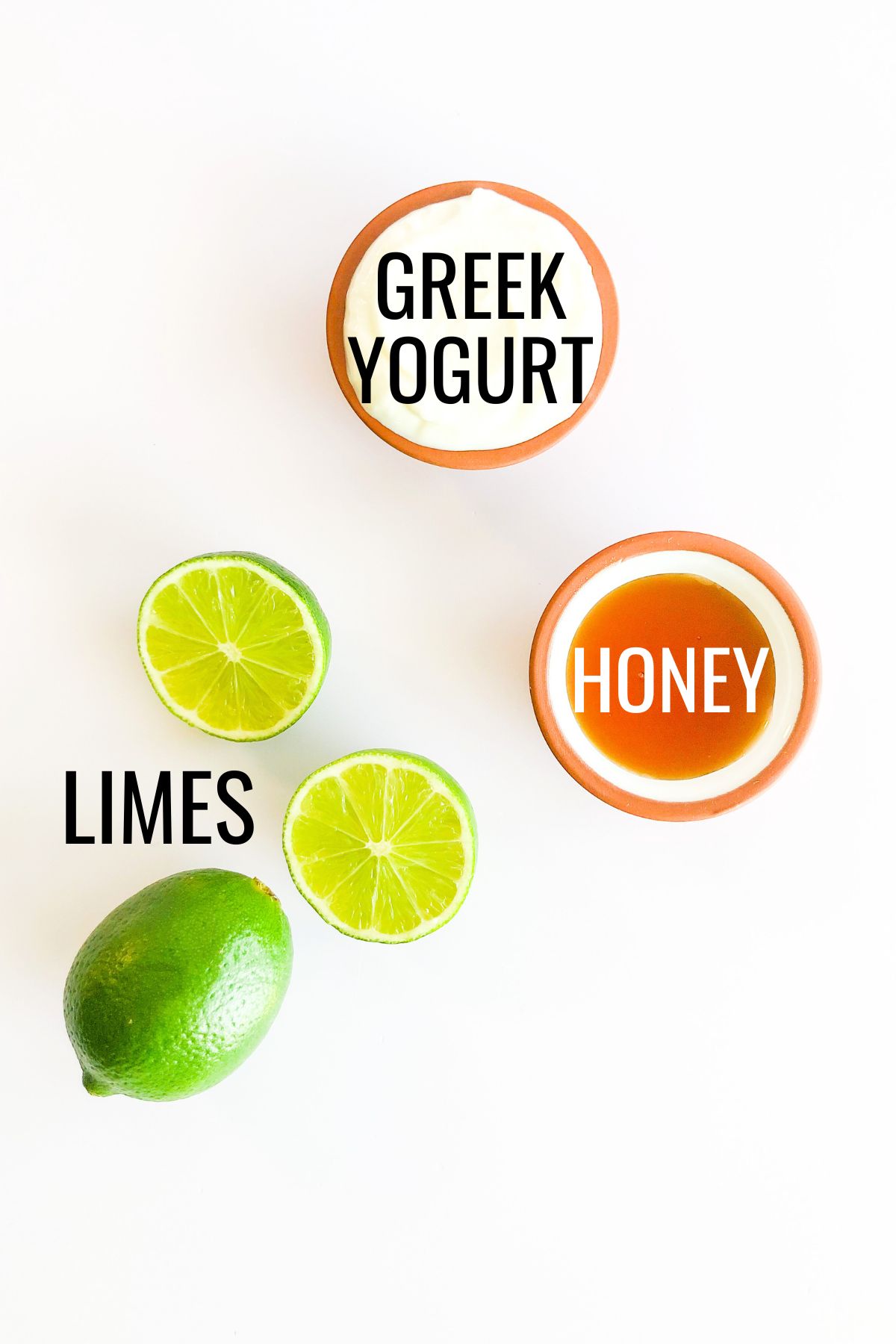 sliced limes, honey, Greek yogurt in small bowls