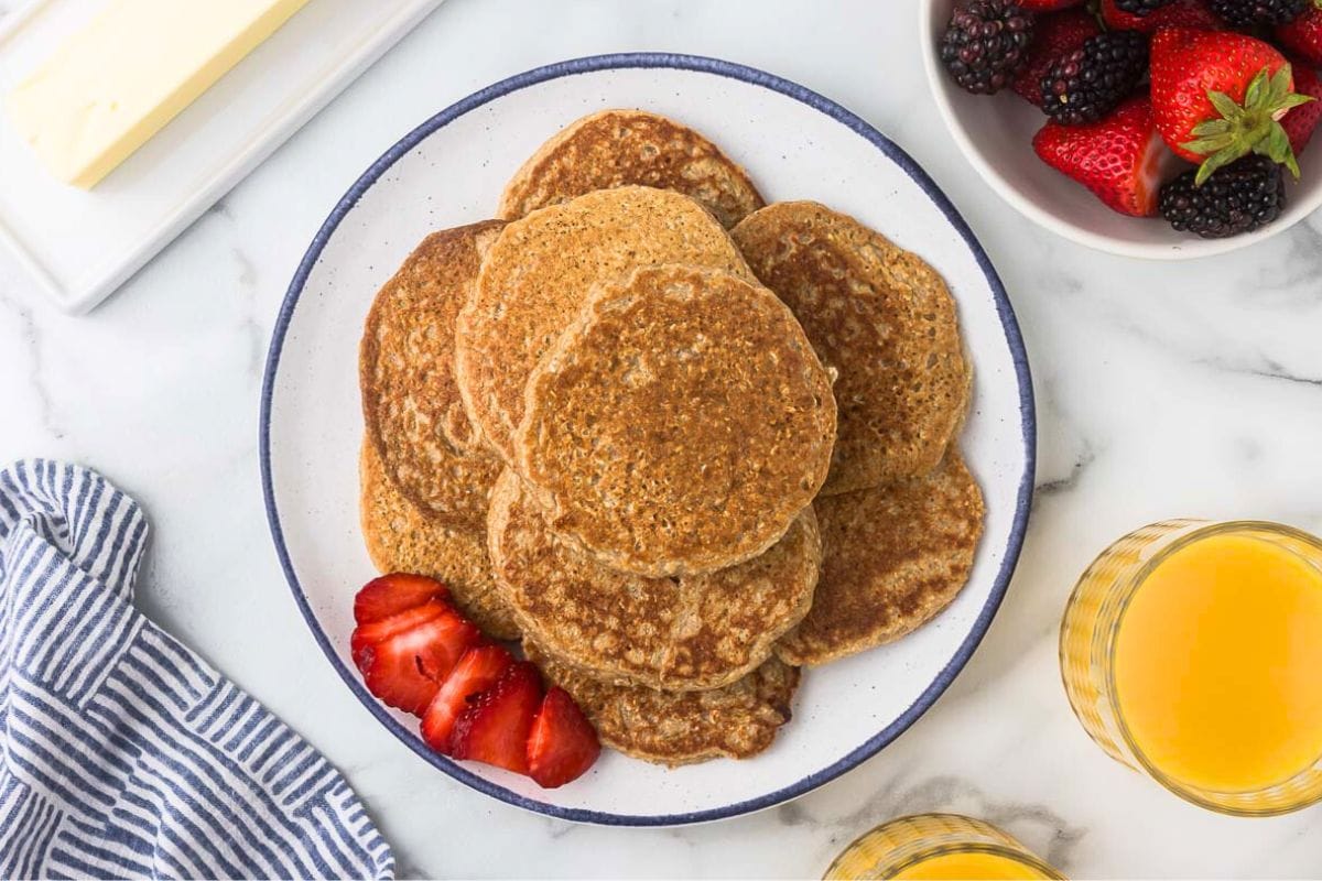 pile of oatmeal cottage cheese pancakes on a white plate