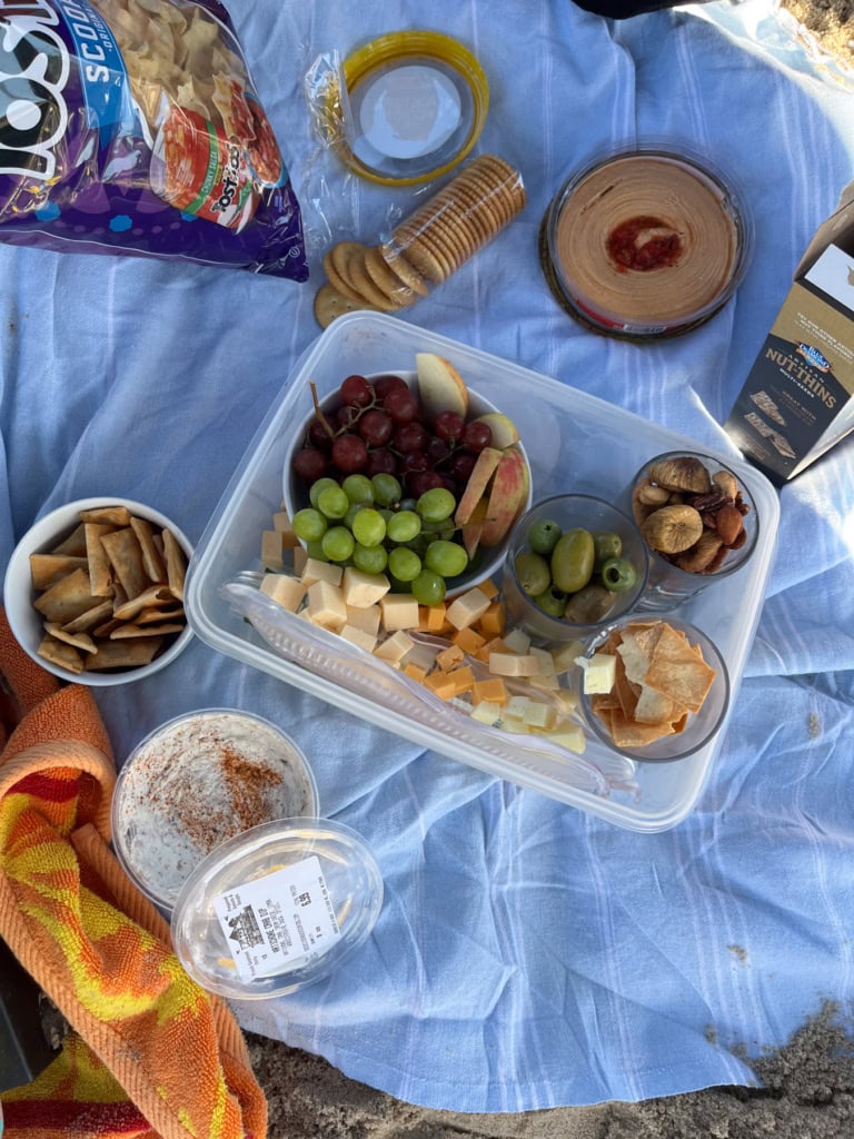 cheese and fruit plate on the beach