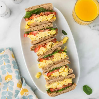 high protein cottage cheese scrambled egg breakfast sandwiches on a white plate