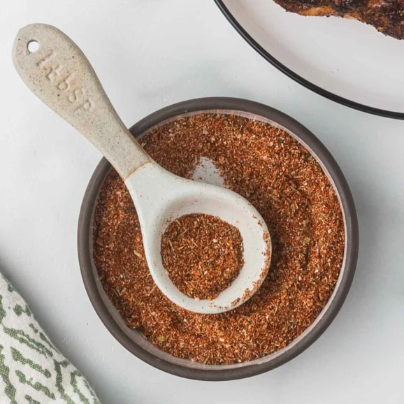 homemade blackening seasoning mix in a small glass bowl with a spoon