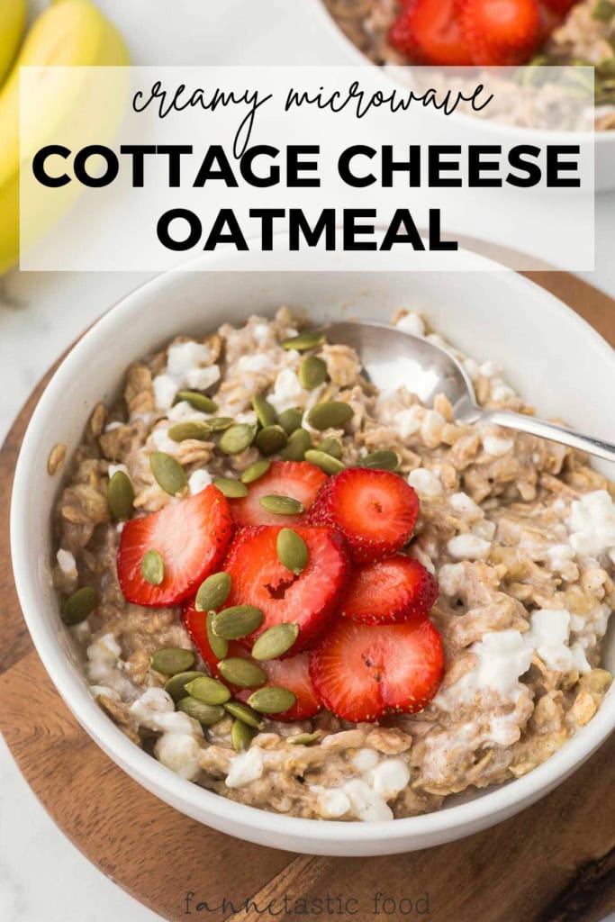 cottage cheese oatmeal topped with sliced strawberries and pumpkin seeds in a bowl