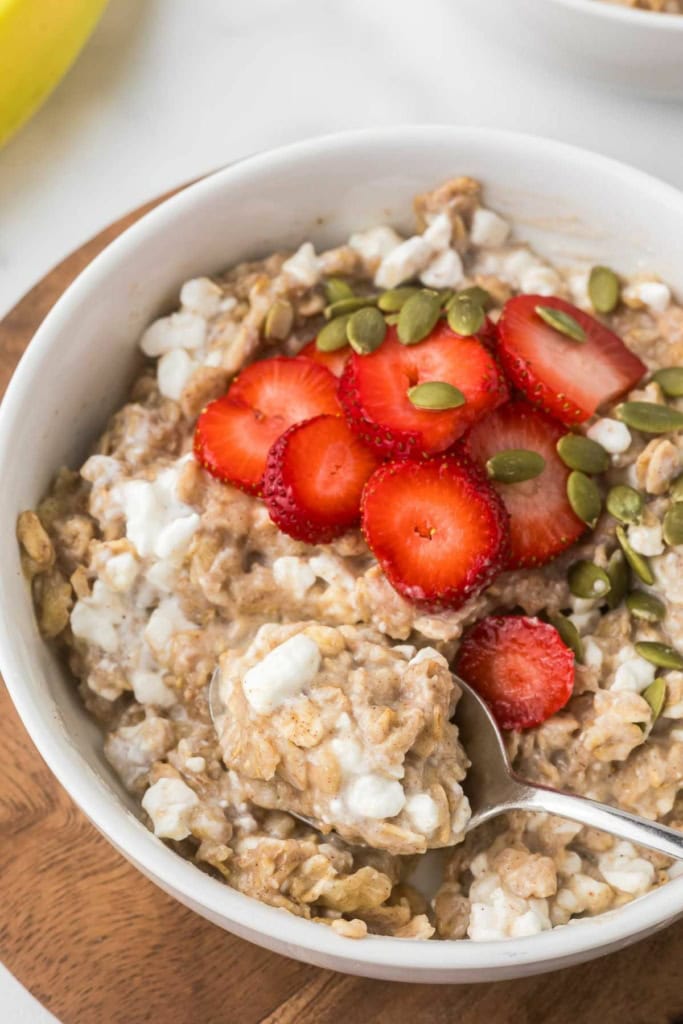 cottage cheese oatmeal in a bowl with a spoon